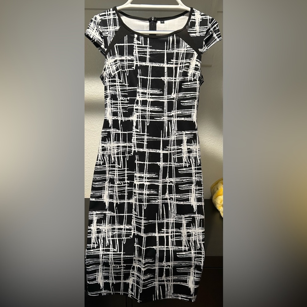 Black with white line bodycon midi dress. Worn a few times. Size M. Cap sleeve.